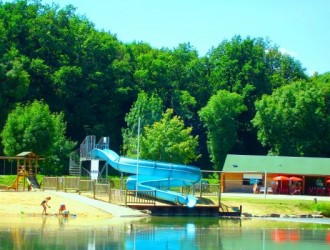 Sandy beach, flume, play area and cafe at St Macoux