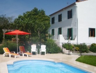 The pool with the villa in the background